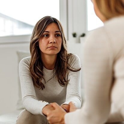 woman with an ADHD coach, learning new skills for self compassion
